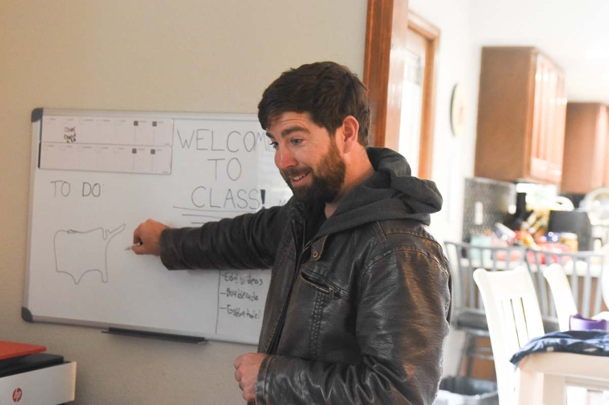 man with a white board