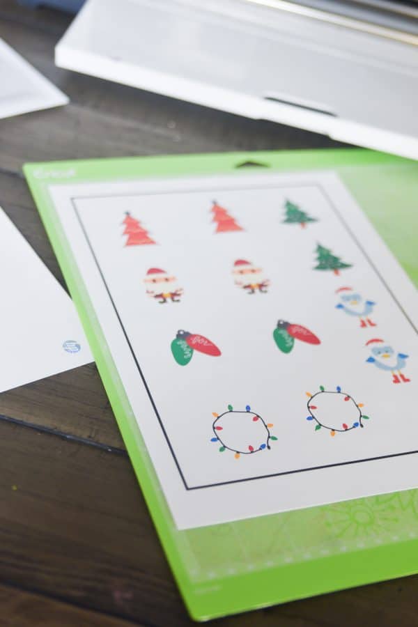 cricut christmas stickers on green mat