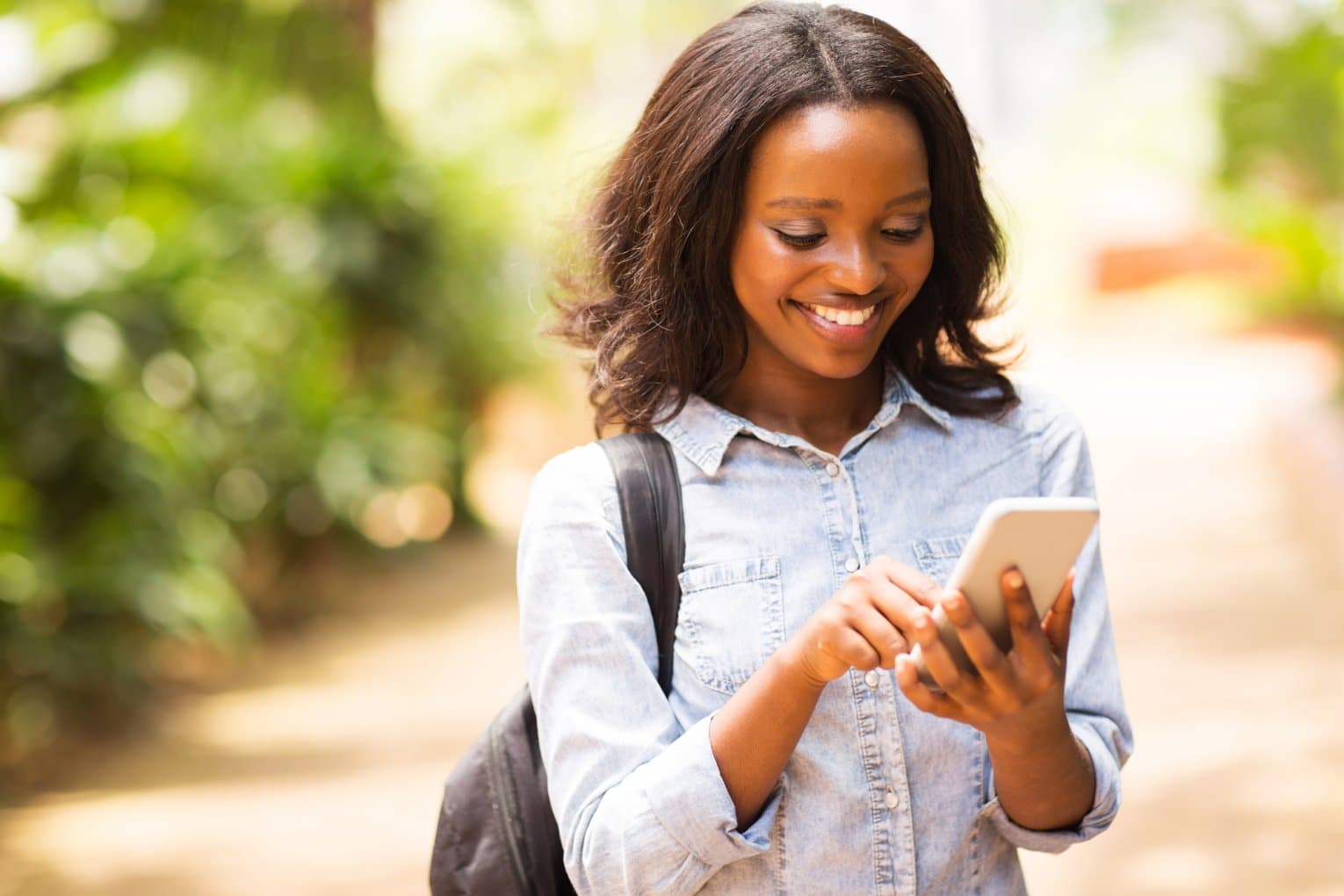 young black woman on cell phone