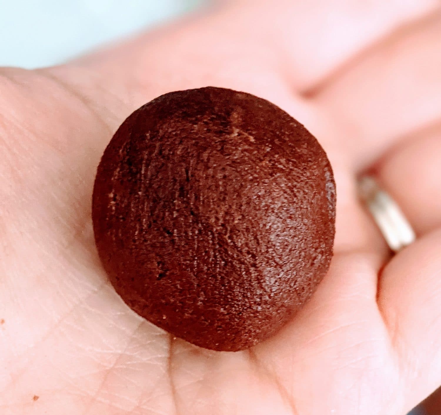 rolled up ball of dough for rolo cookies