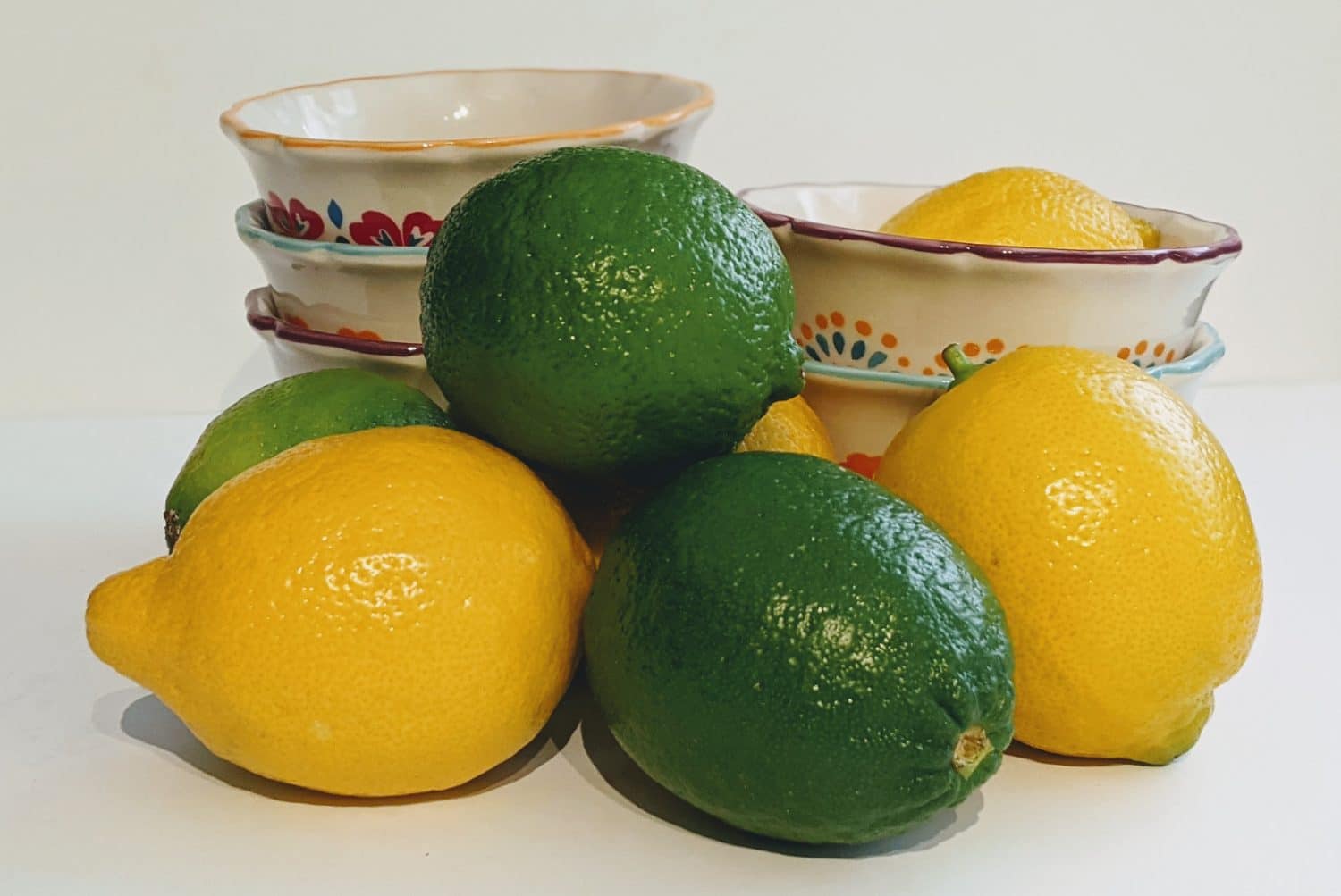 lemons and limes in a dish