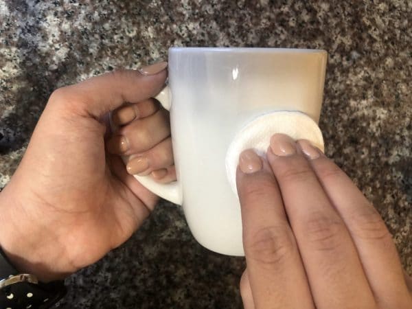 cleaning mug with rubbing alcohol