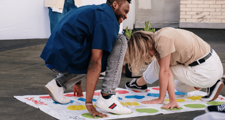 adults playing twister