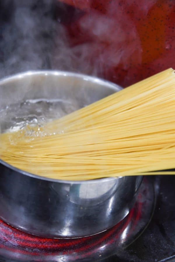 boiling noodles in a pot