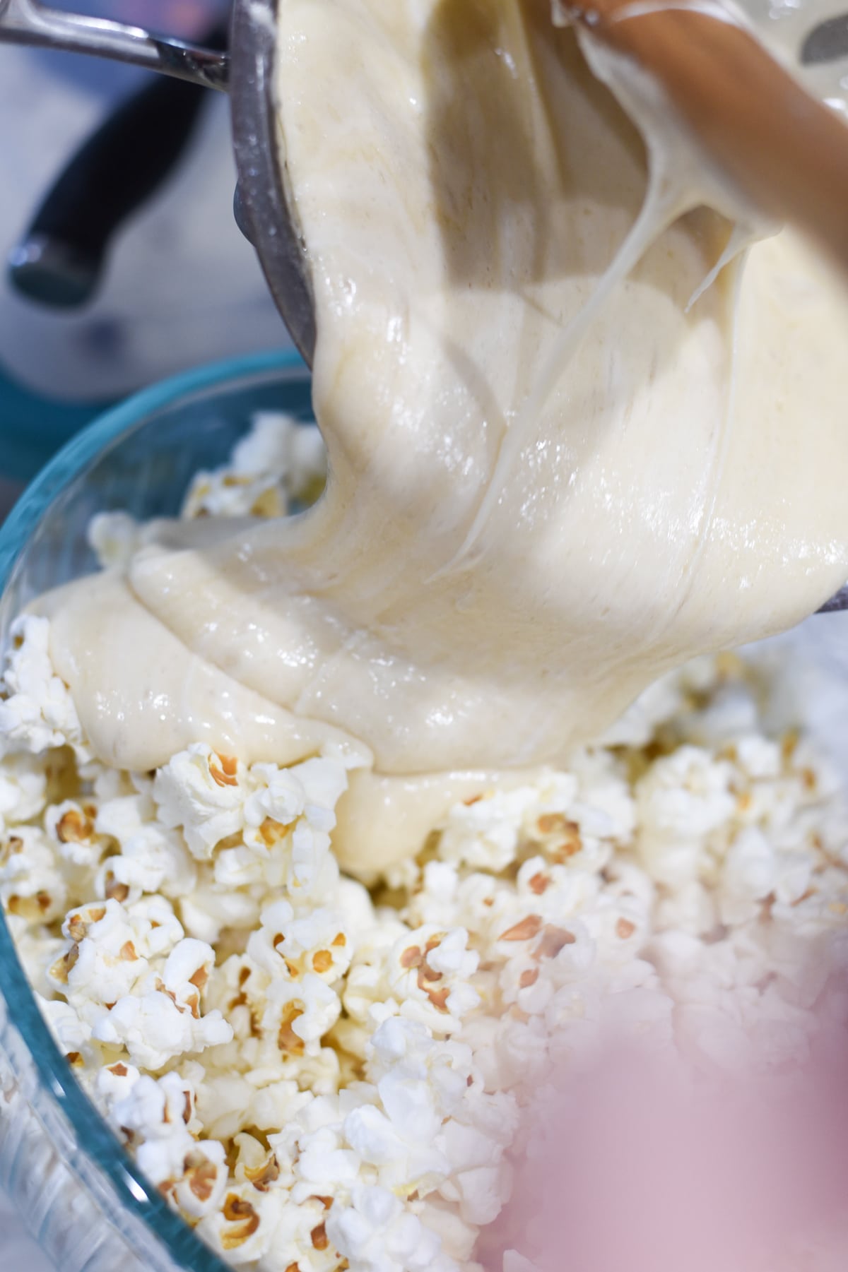 Pouring caramel over popcorn